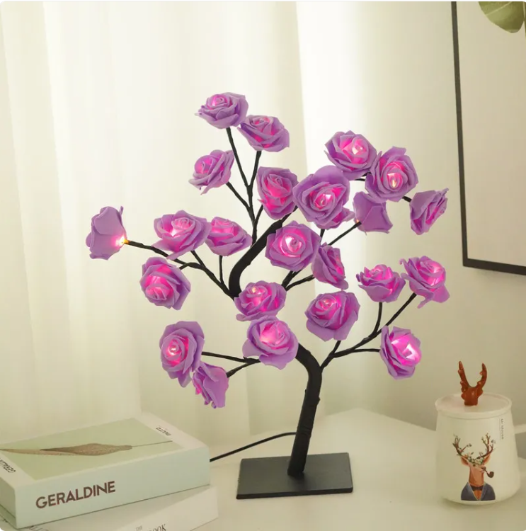 Flores con luces led rosa en una habitación