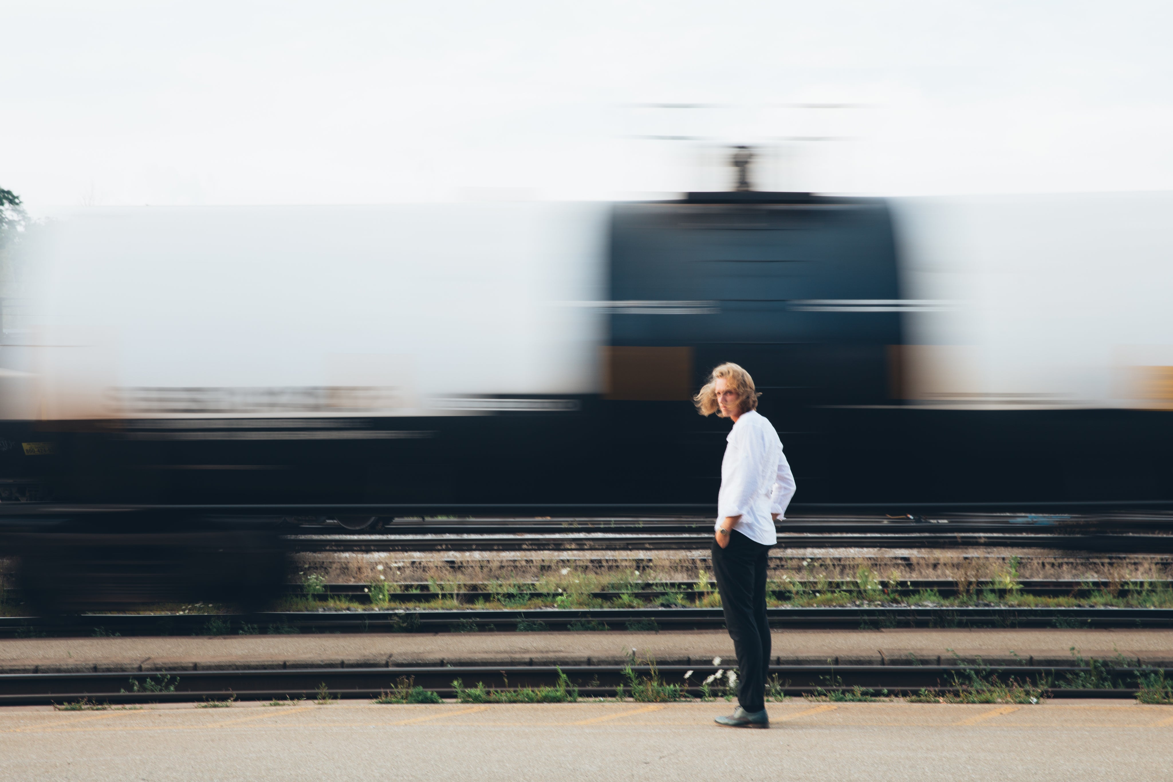 files/man-standing-by-train.jpg